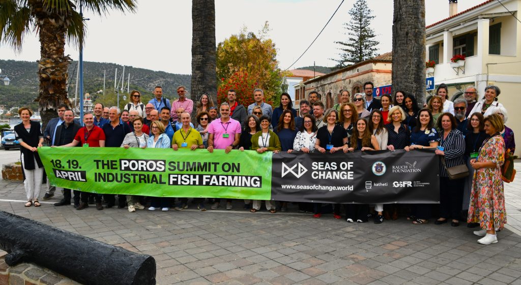 Shows the Seas of Change group outside summit on industrial fish farming