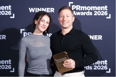 two people holding an award