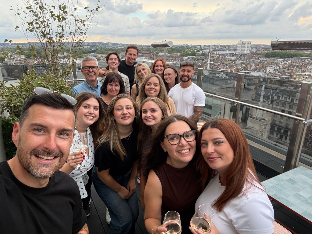 Spa Comms team on a roof top